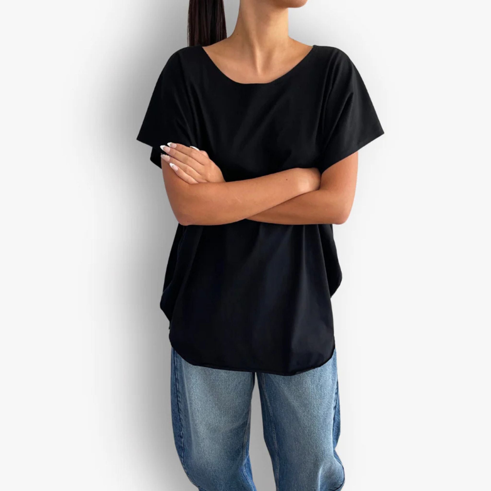 Model wearing black oversized circular hem short sleeve cotton t-shirt