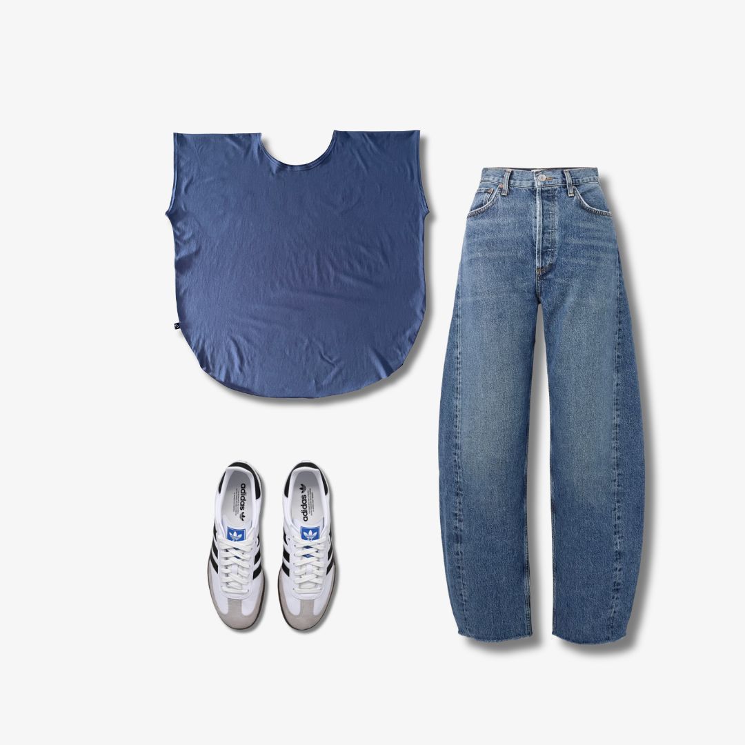 Blue tshirt, barrel jeans, and white sneakers on a white background