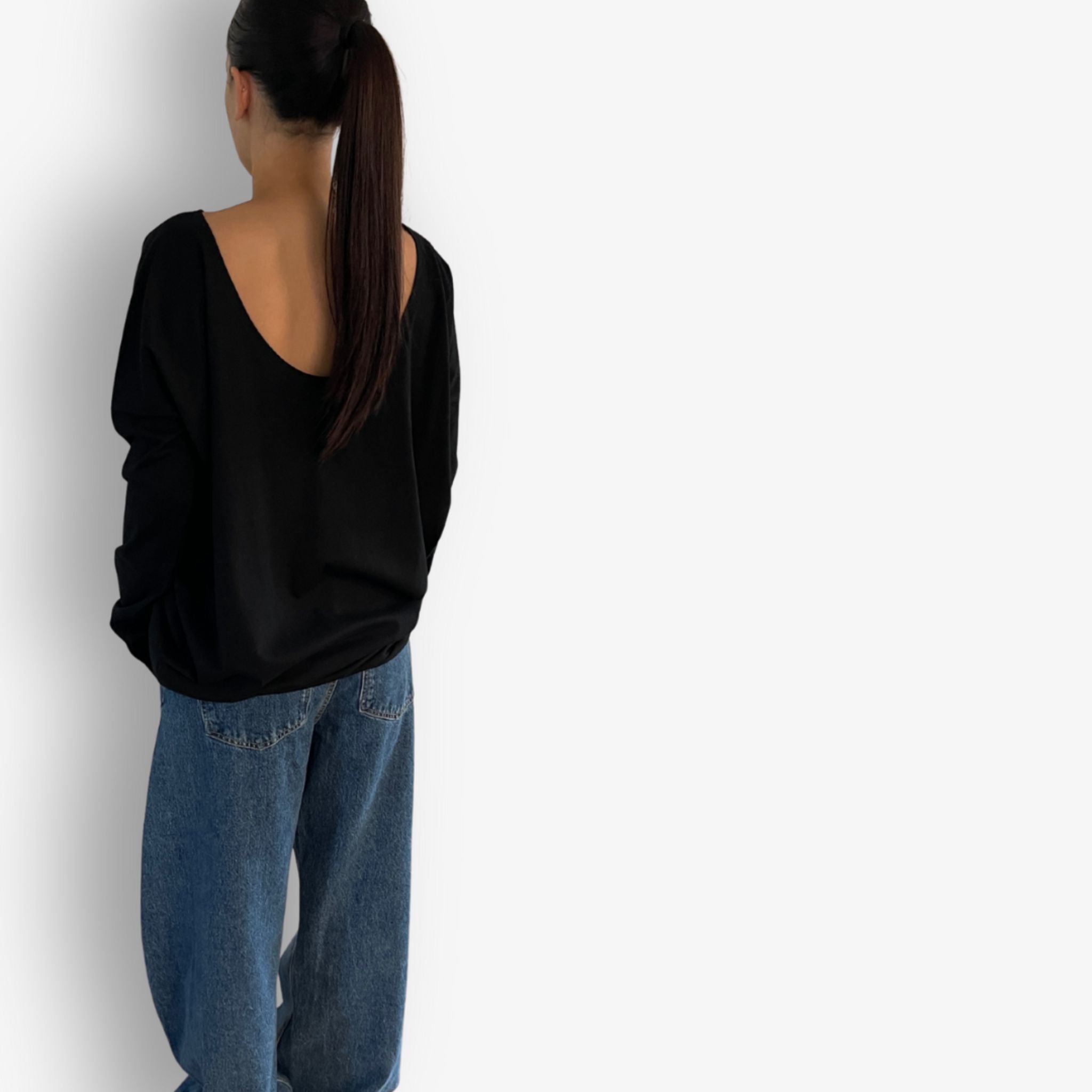 Back view of Two Daughters reversible long sleeve circular t-shirt in black.