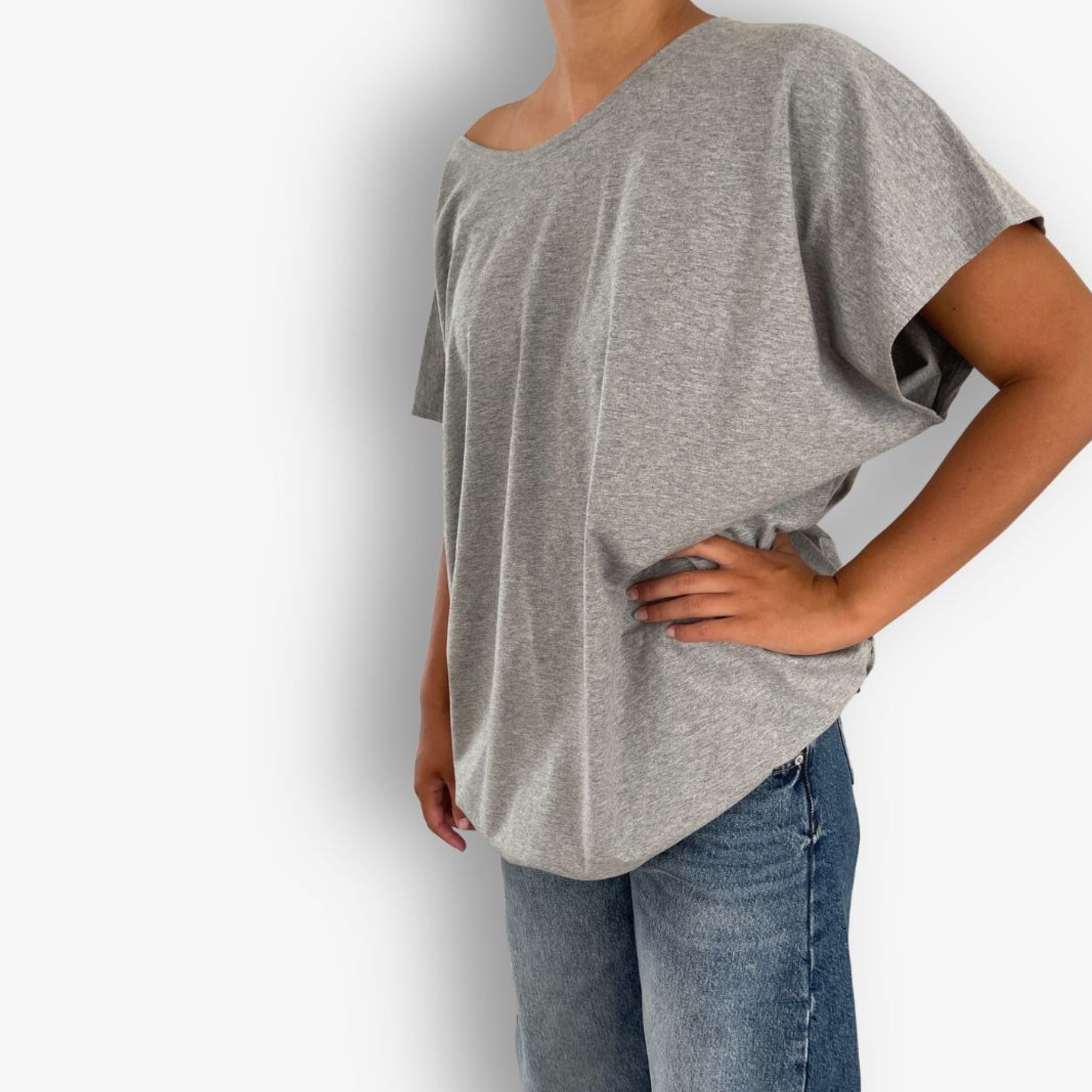 Side view of women’s grey marle circular hem t-shirt by Two Daughters showing soft drape and oversized silhouette.