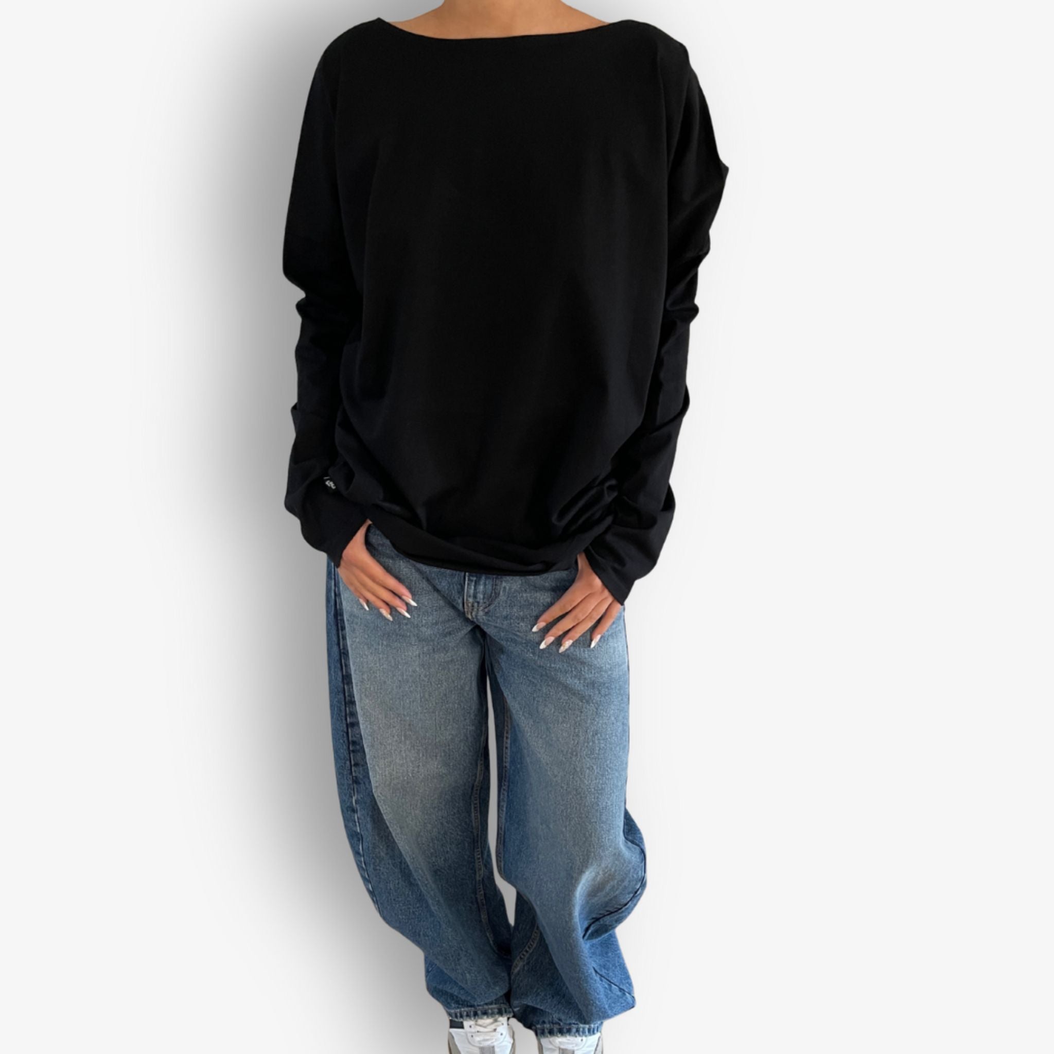 Lifestyle image of Two Daughters reversible long sleeve circular t‑shirt in black styled outfit.